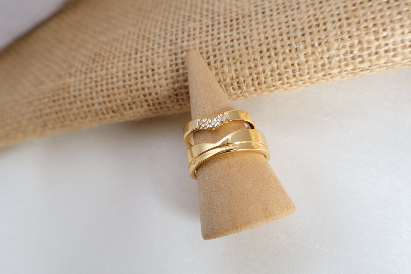 Luxury 14kt gold wedding ring set, women's 5-diamond band and men's 6mm ring. Packaged in sustainable jewelry boxes, ideal for corporate service awards in SG.