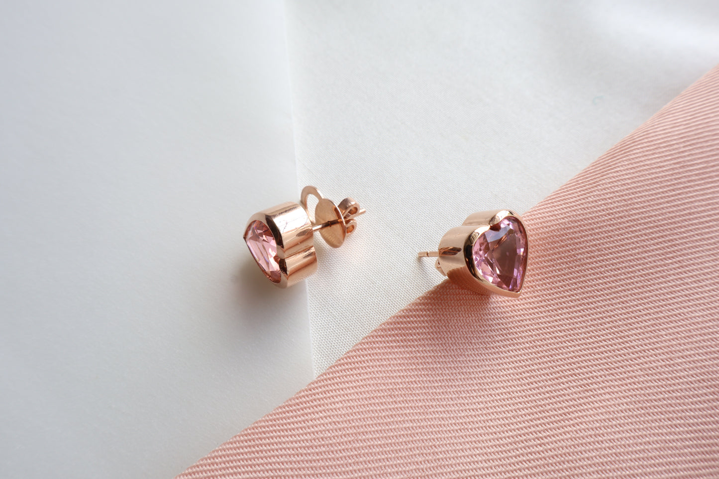 18K rose gold heart-shaped stud earrings with natural pink sapphires (2.64 carats each, 10mm) — Singapore bespoke corporate jewelry, business milestone gift, custom luxury gemstone piece.