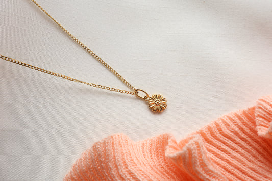 Dainty 8mm 14K Gold Floral Pendant. Premium eco-friendly corporate gift jewelry in abaca packaging for bespoke employee recognition in Singapore