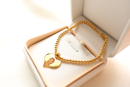 Personalized 14K Gold portrait-engraved heart charm on 7-inch 18K beaded chain. Ideal premium corporate giveaway and commemorative gift in Singapore