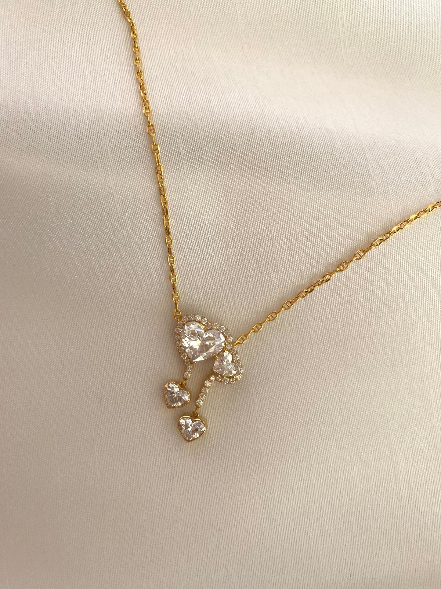 18K gold necklace featuring a 3ct diamond and GIA-certified heart diamonds. Sustainable corporate gift jewelry with abaca packaging. Custom gold-plated necklace, bespoke design in Singapore.