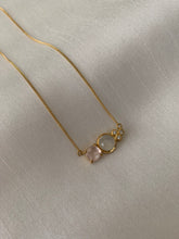 Load image into Gallery viewer, A peach cushion morganite, moonstone at the center and 3 small russian diamonds. Put into a yellow gold necklace.
