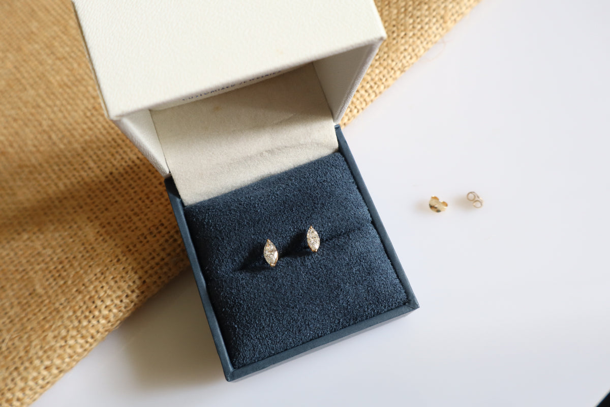 14K gold earrings featuring lab-grown marquise diamonds in a minimalist design.