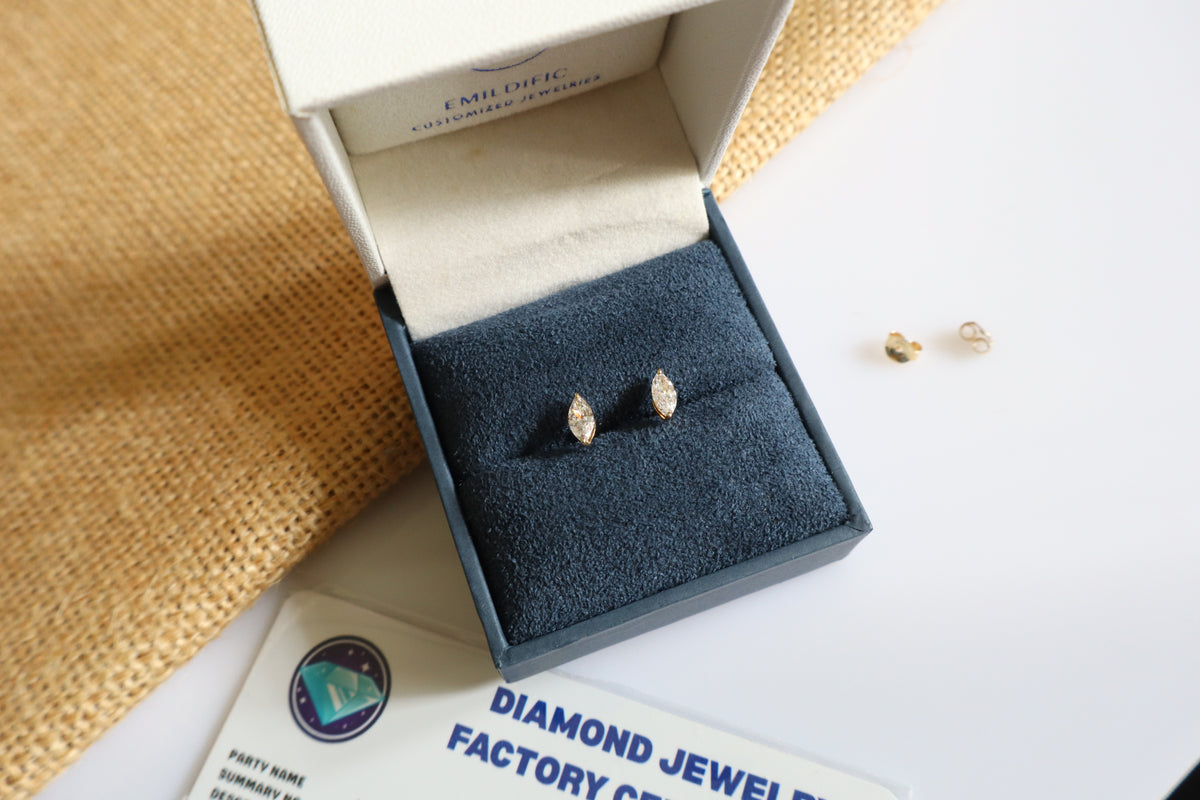 14K gold earrings featuring lab-grown marquise diamonds in a minimalist design.