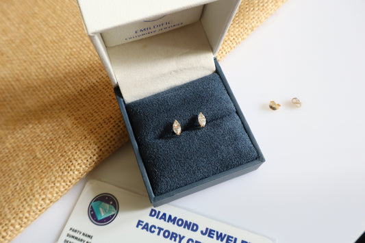 14K gold earrings featuring lab-grown marquise diamonds in a minimalist design.