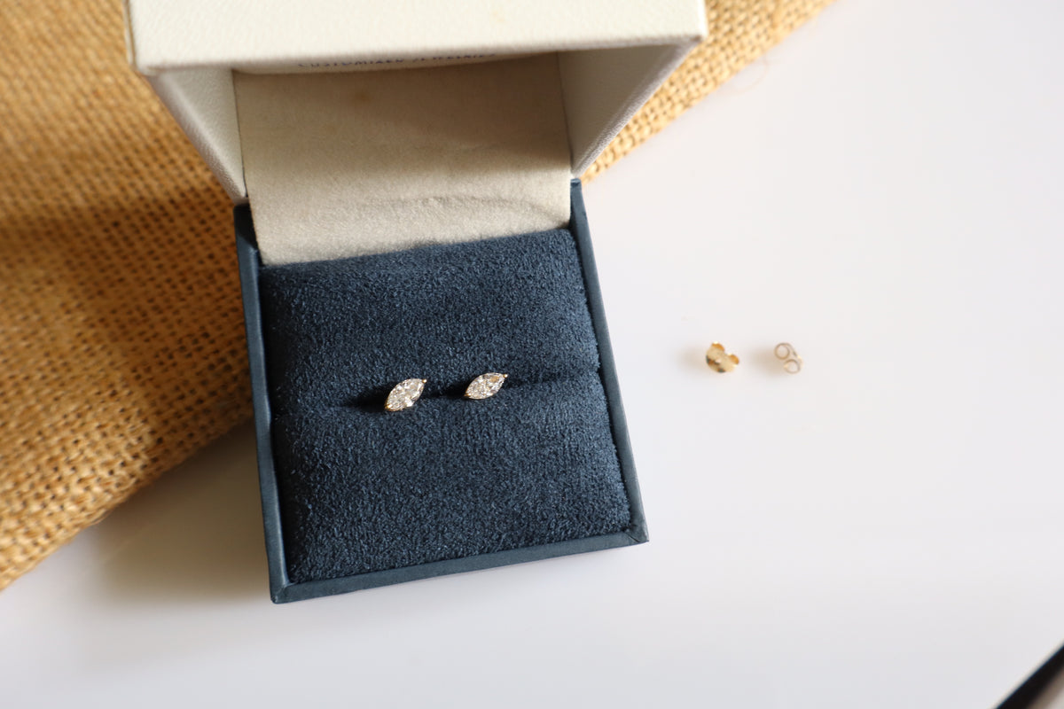 14K gold earrings featuring lab-grown marquise diamonds in a minimalist design.