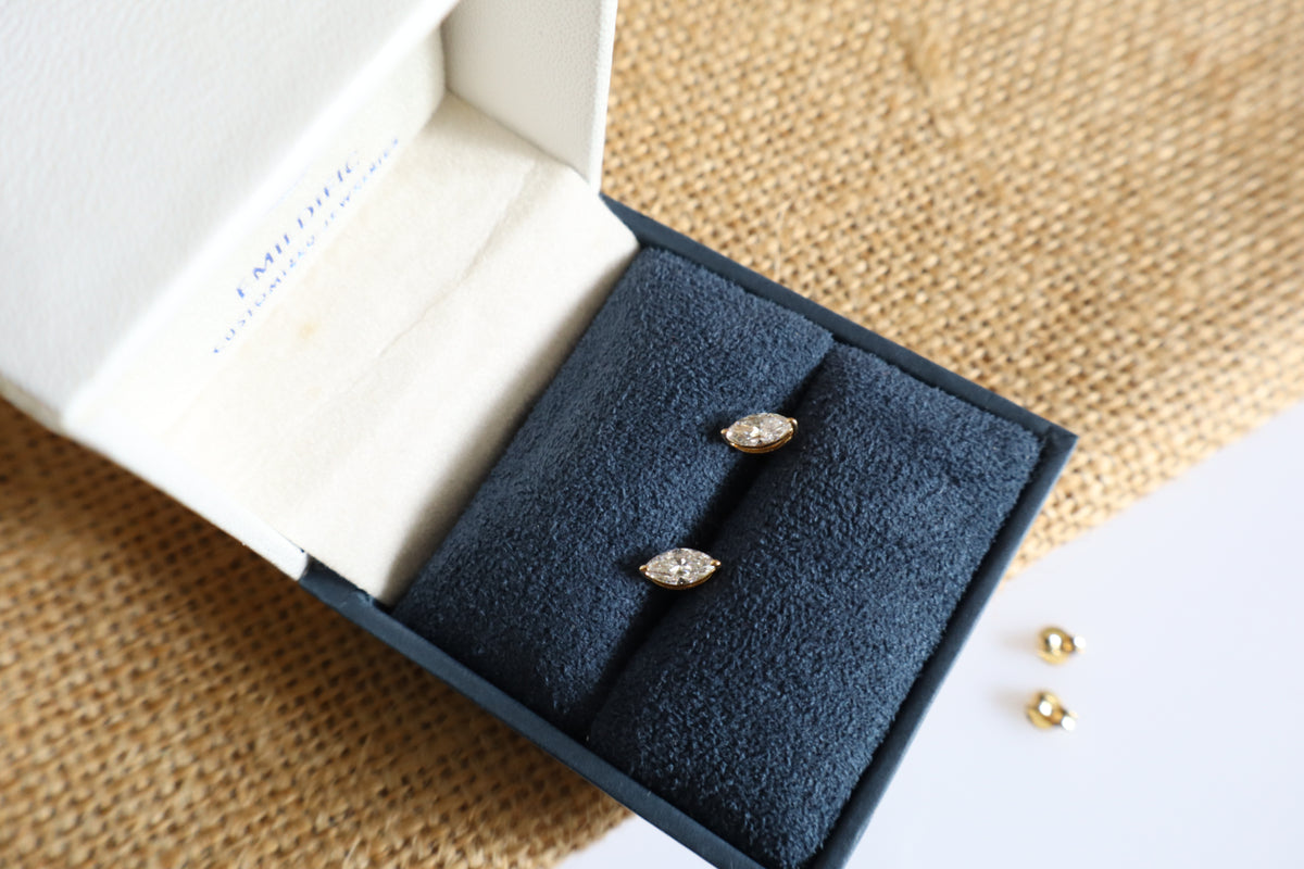 14K gold earrings featuring lab-grown marquise diamonds in a minimalist design.