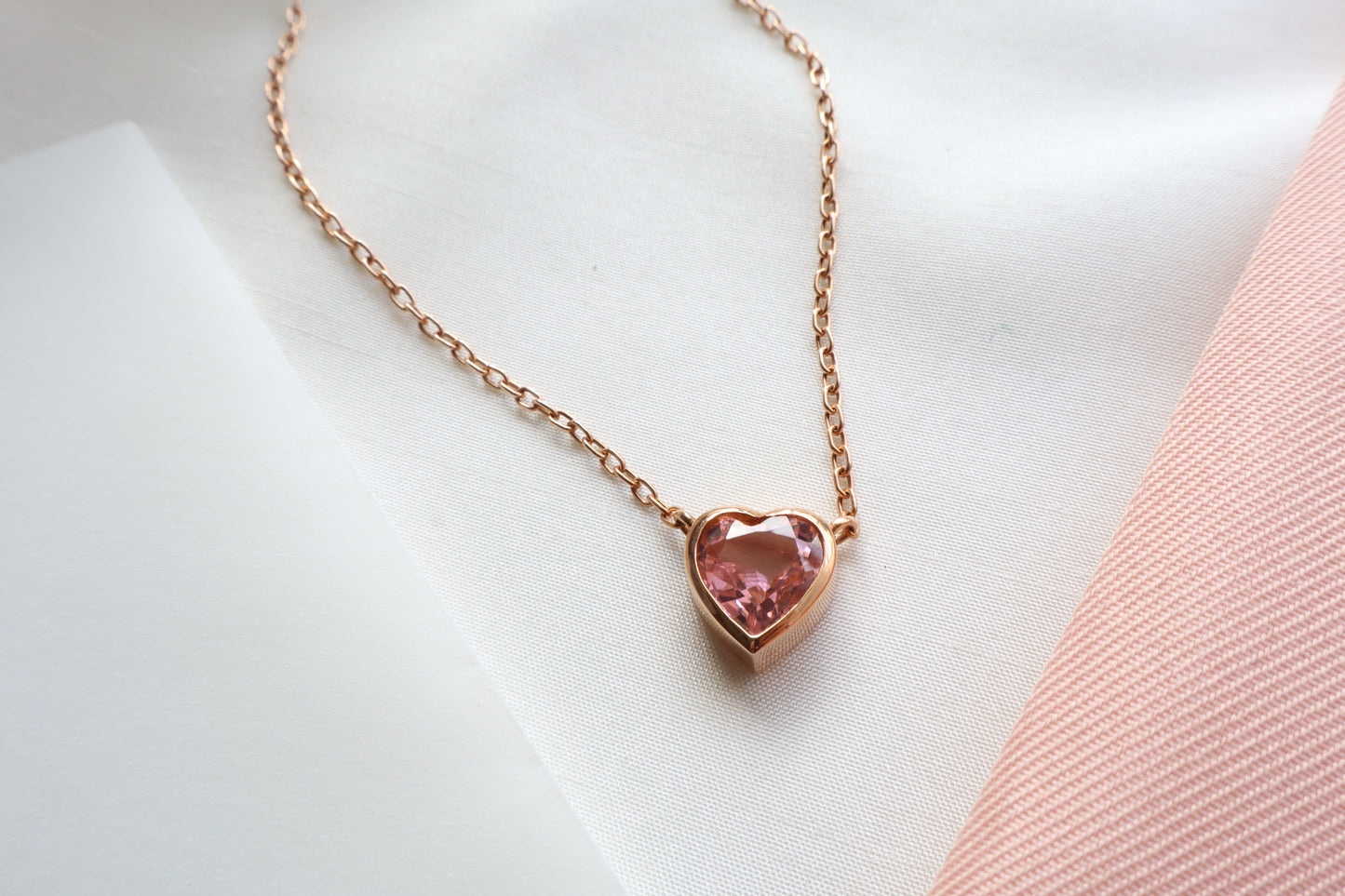 18K rose gold heart necklace with 2.64 carat pink sapphire on an 18-inch chain — Singapore business milestone jewelry, luxury corporate gift, commemorative service award piece with elegant presentation