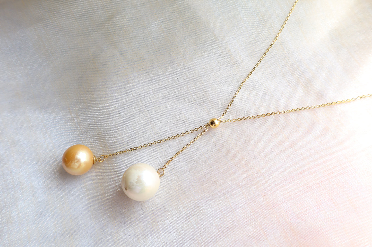 Adjustable pearl drop necklace on solid 18K gold chain with sliding bead mechanism — custom fine jewelry necklace upgrade in Singapore.