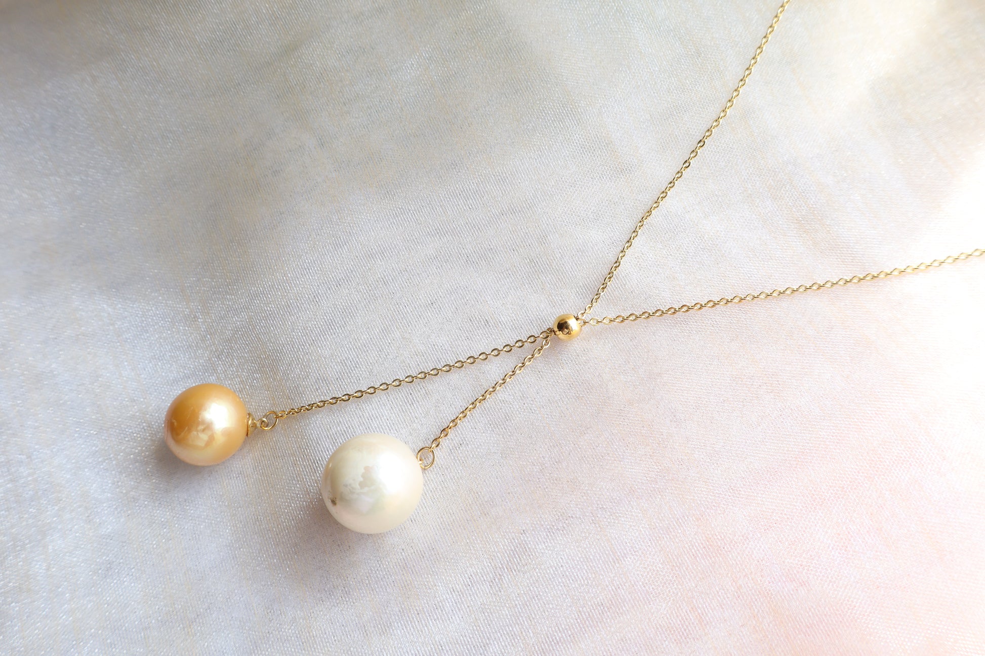 Adjustable pearl drop necklace on solid 18K gold chain with sliding bead mechanism — custom fine jewelry necklace upgrade in Singapore.