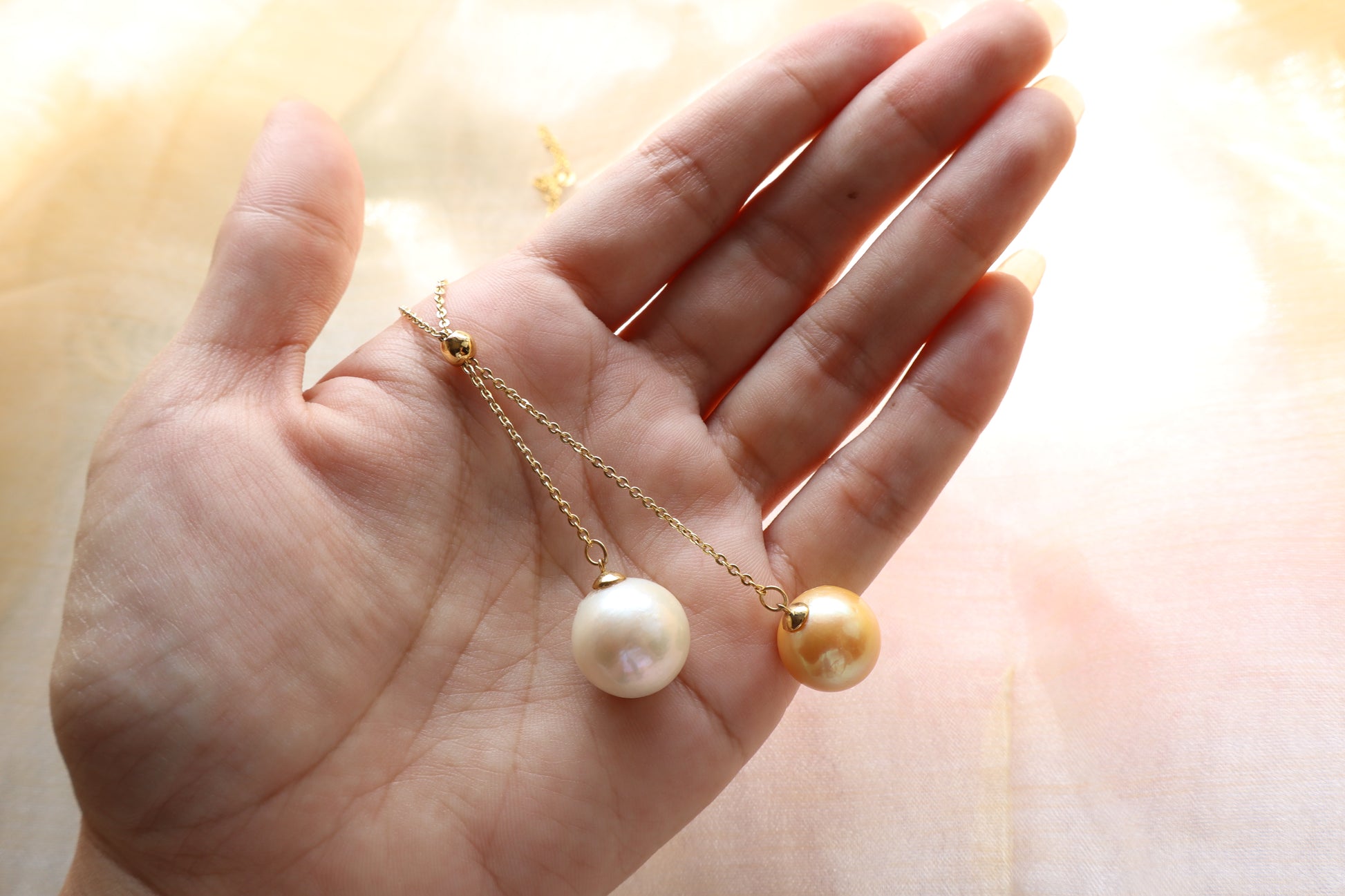 Adjustable pearl drop necklace on solid 18K gold chain with sliding bead mechanism — custom fine jewelry necklace upgrade in Singapore.