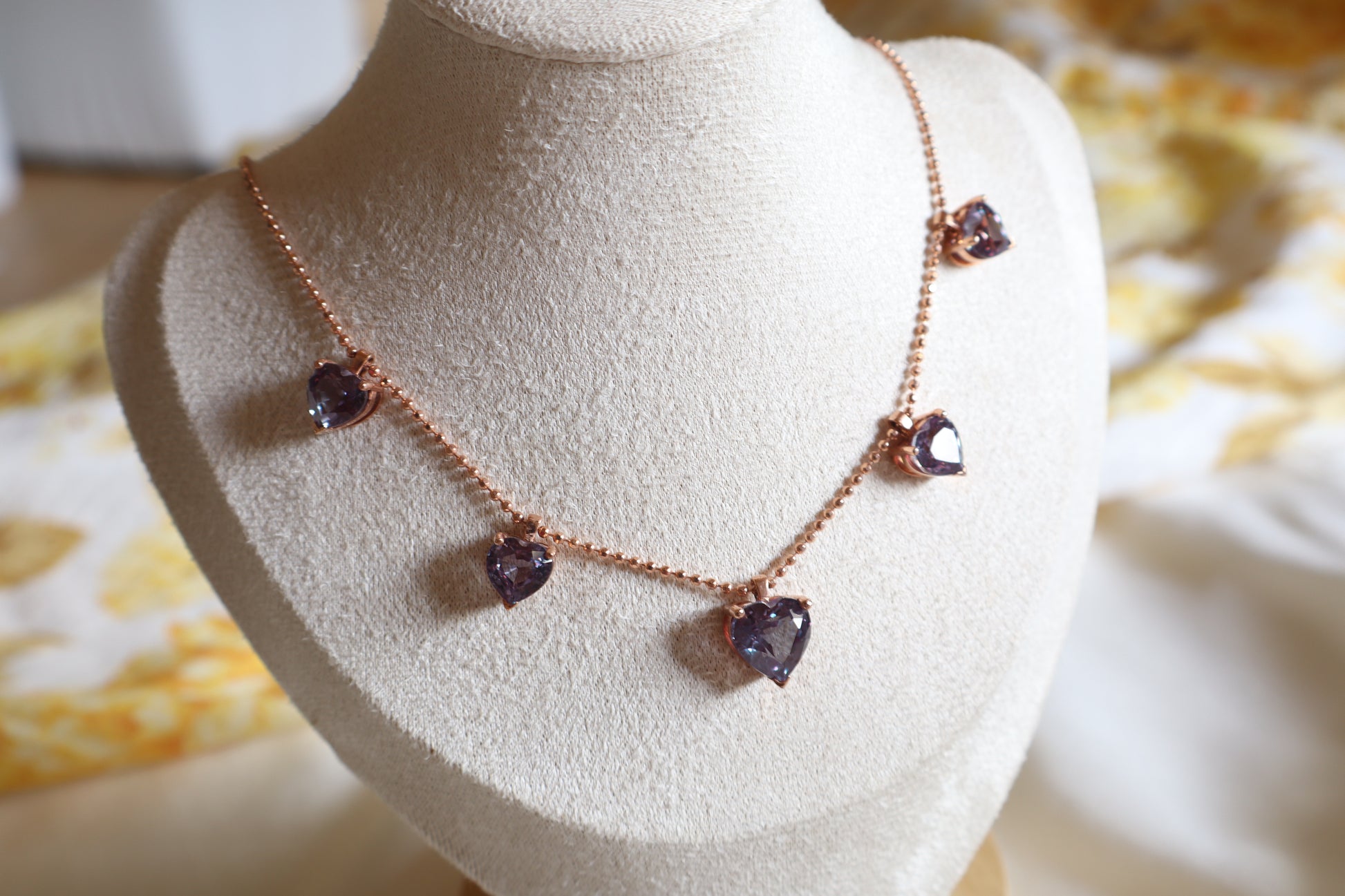 18K rose gold necklace with five alexandrite gemstones in bezel settings. A rare fine jewelry piece in Singapore, elegantly packaged for gifts or corporate milestones.