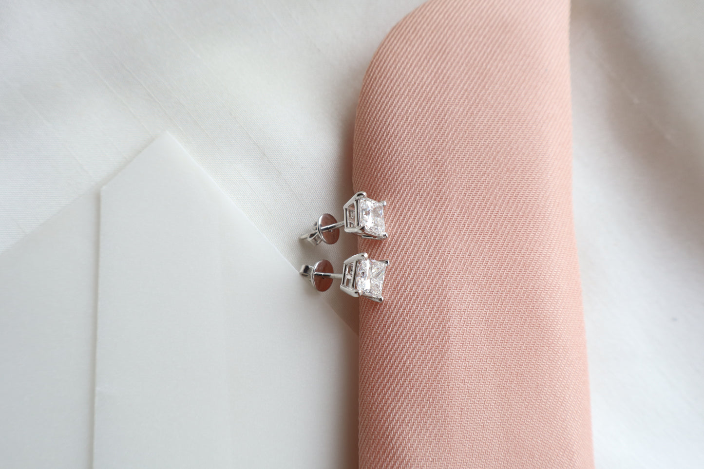 Elegant 14K white gold diamond stud earrings featuring 1.5-carat diamonds each, custom-crafted for timeless everyday wear, presented in eco-friendly packaging for Singapore corporate gifting.