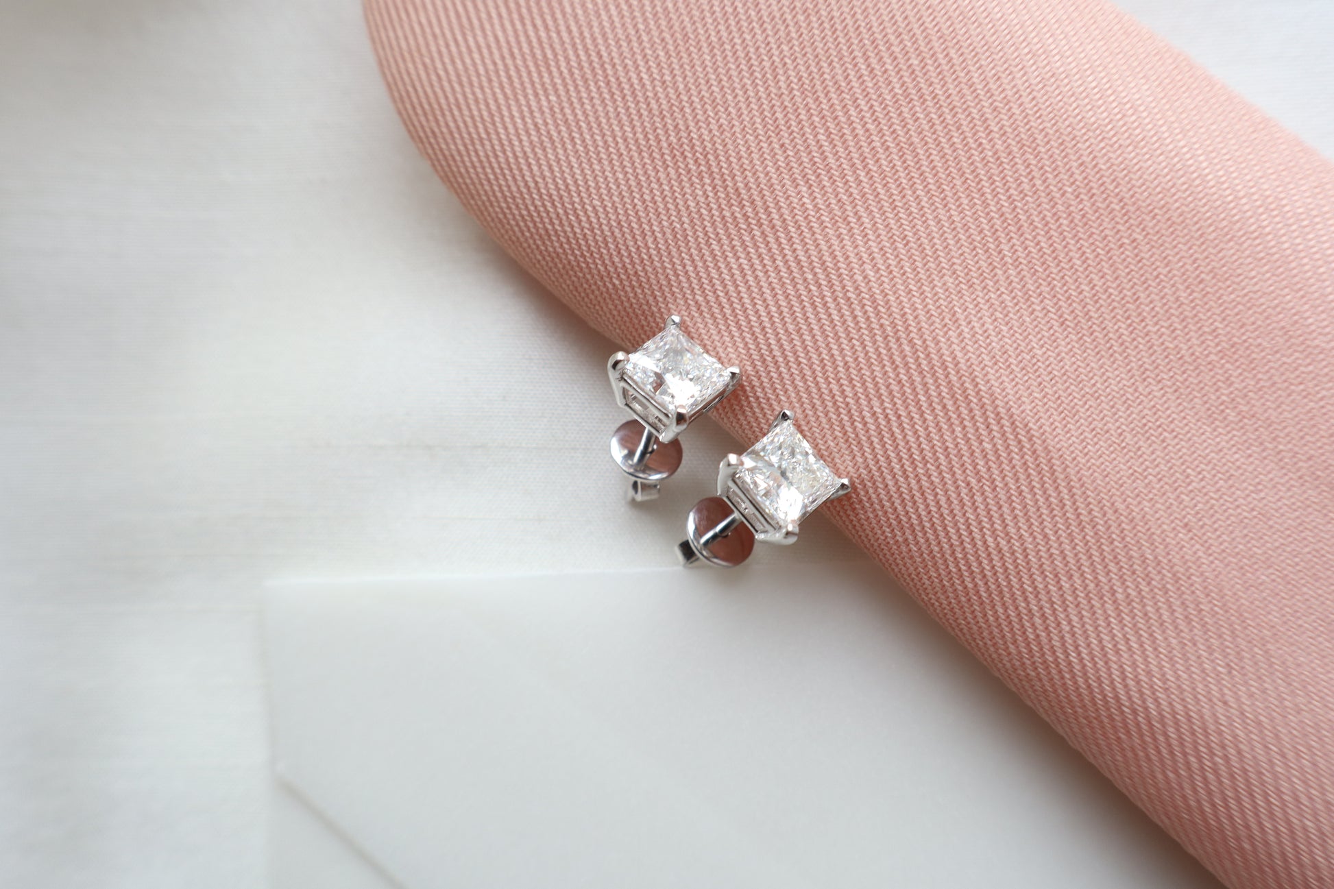 Elegant 14K white gold diamond stud earrings featuring 1.5-carat diamonds each, custom-crafted for timeless everyday wear, presented in eco-friendly packaging for Singapore corporate gifting.