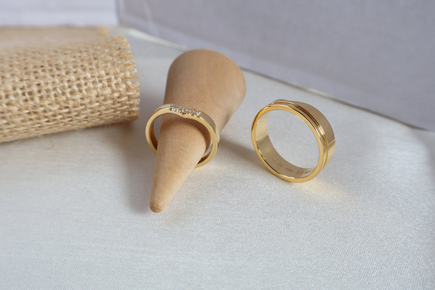 Luxury 14kt gold wedding ring set, women's 5-diamond band and men's 6mm ring. Packaged in sustainable jewelry boxes, ideal for corporate service awards in SG.