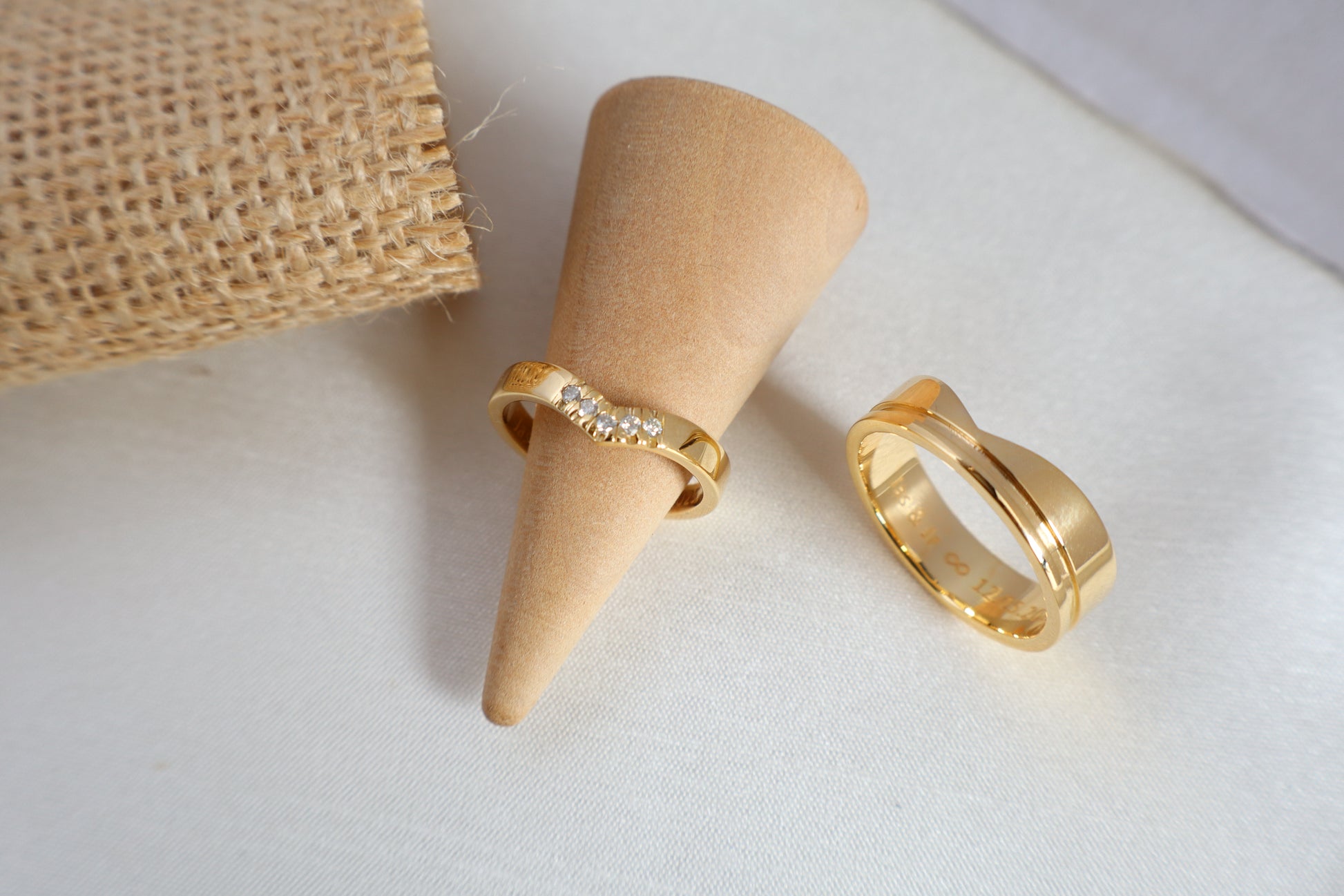 Luxury 14kt gold wedding ring set, women's 5-diamond band and men's 6mm ring. Packaged in sustainable jewelry boxes, ideal for corporate service awards in SG.