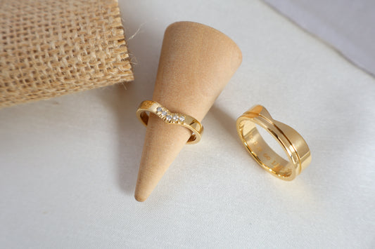 Luxury 14kt gold wedding ring set, women's 5-diamond band and men's 6mm ring. Packaged in sustainable jewelry boxes, ideal for corporate service awards in SG.