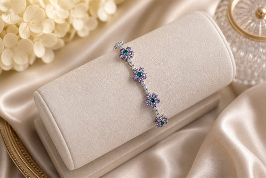 Luxury 18K white gold flower bracelet with natural amethyst, emerald, and diamond gemstones, custom-made as a meaningful heirloom gift and presented in an eco box.