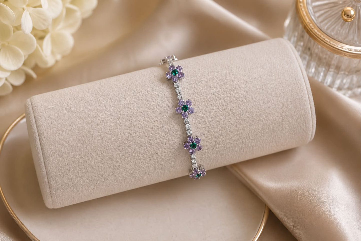 Luxury 18K white gold flower bracelet with natural amethyst, emerald, and diamond gemstones, custom-made as a meaningful heirloom gift and presented in an eco box.