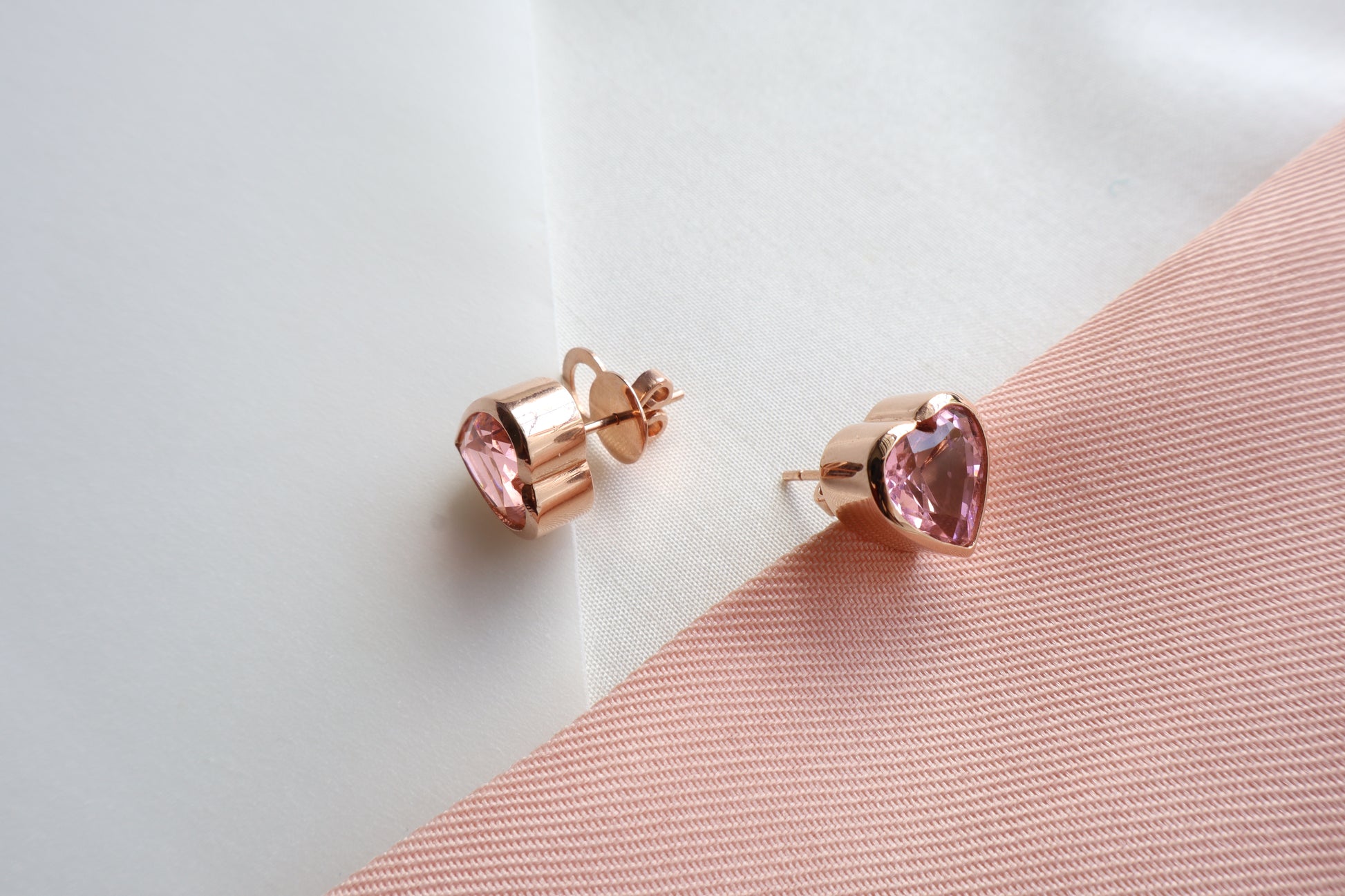 18K rose gold heart-shaped stud earrings with natural pink sapphires (2.64 carats each, 10mm) — Singapore bespoke corporate jewelry, business milestone gift, custom luxury gemstone piece.