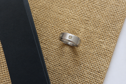 Handcrafted Platinum 950 ring featuring three natural diamonds in a modern brushed design. Ideal example of custom jewelry craftsmanship for corporate awards, service pins, and premium gifting.