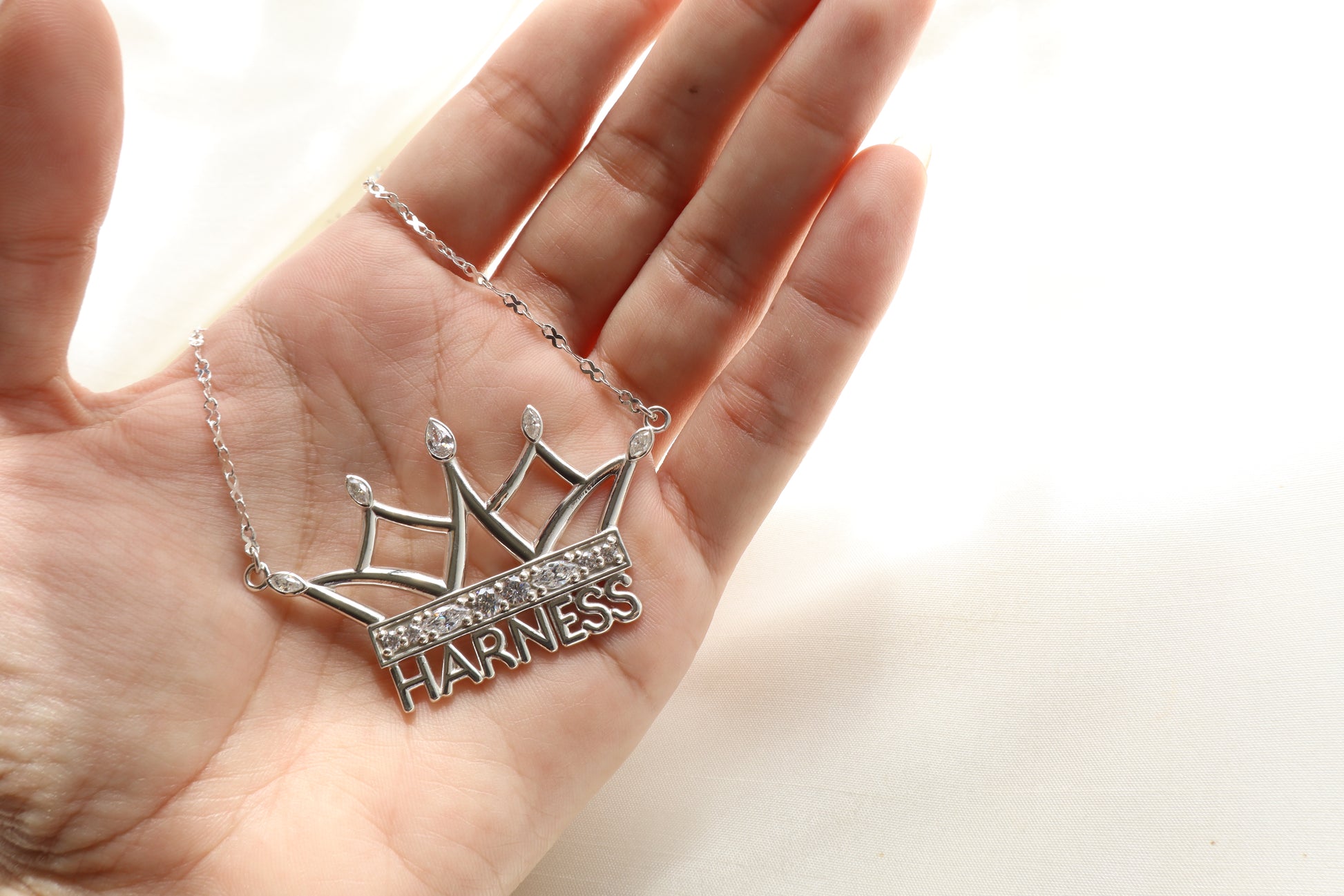 Corporate jewelry supplier Singapore — custom crown necklace in silver with signity stones, personalized statement pendant