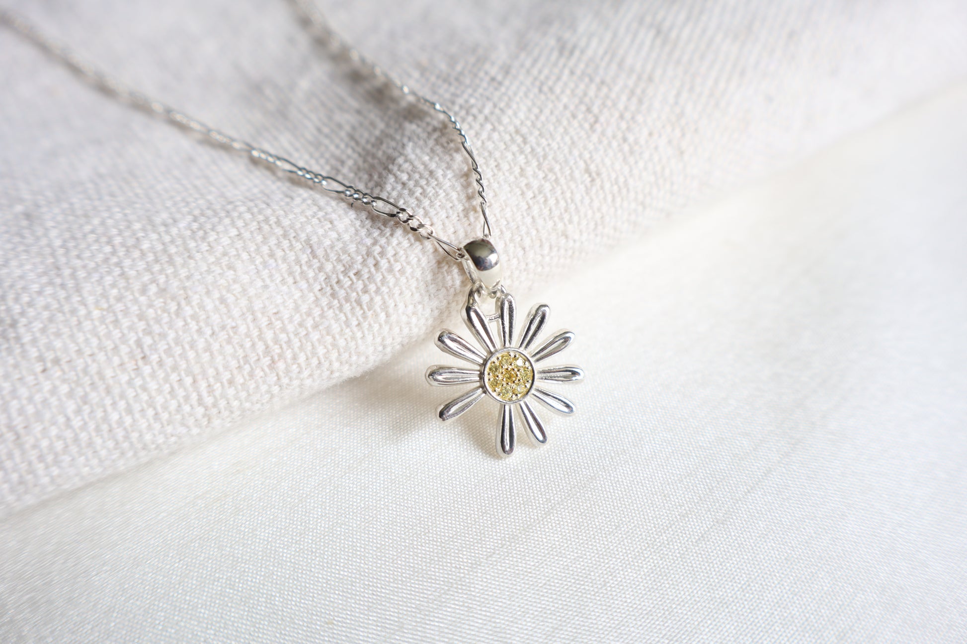 925 Silver K-Pop idol daisy pendant with Yellow Sapphires, showcased in Singapore custom gift packaging for corporate events