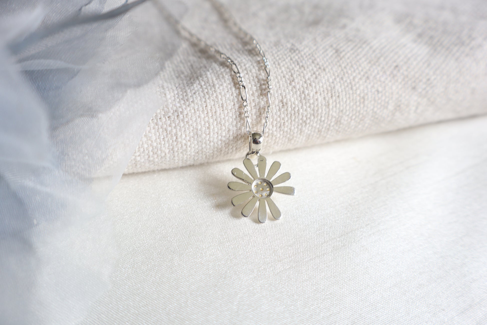 925 Silver K-Pop idol daisy pendant with Yellow Sapphires, showcased in Singapore custom gift packaging for corporate events