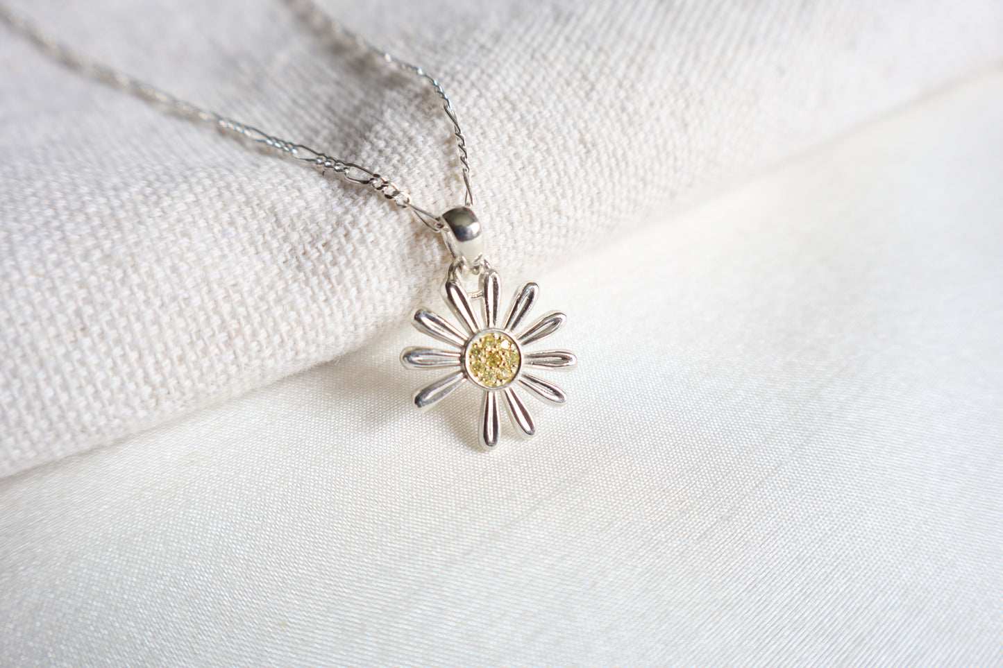 925 Silver K-Pop idol daisy pendant with Yellow Sapphires, showcased in Singapore custom gift packaging for corporate events