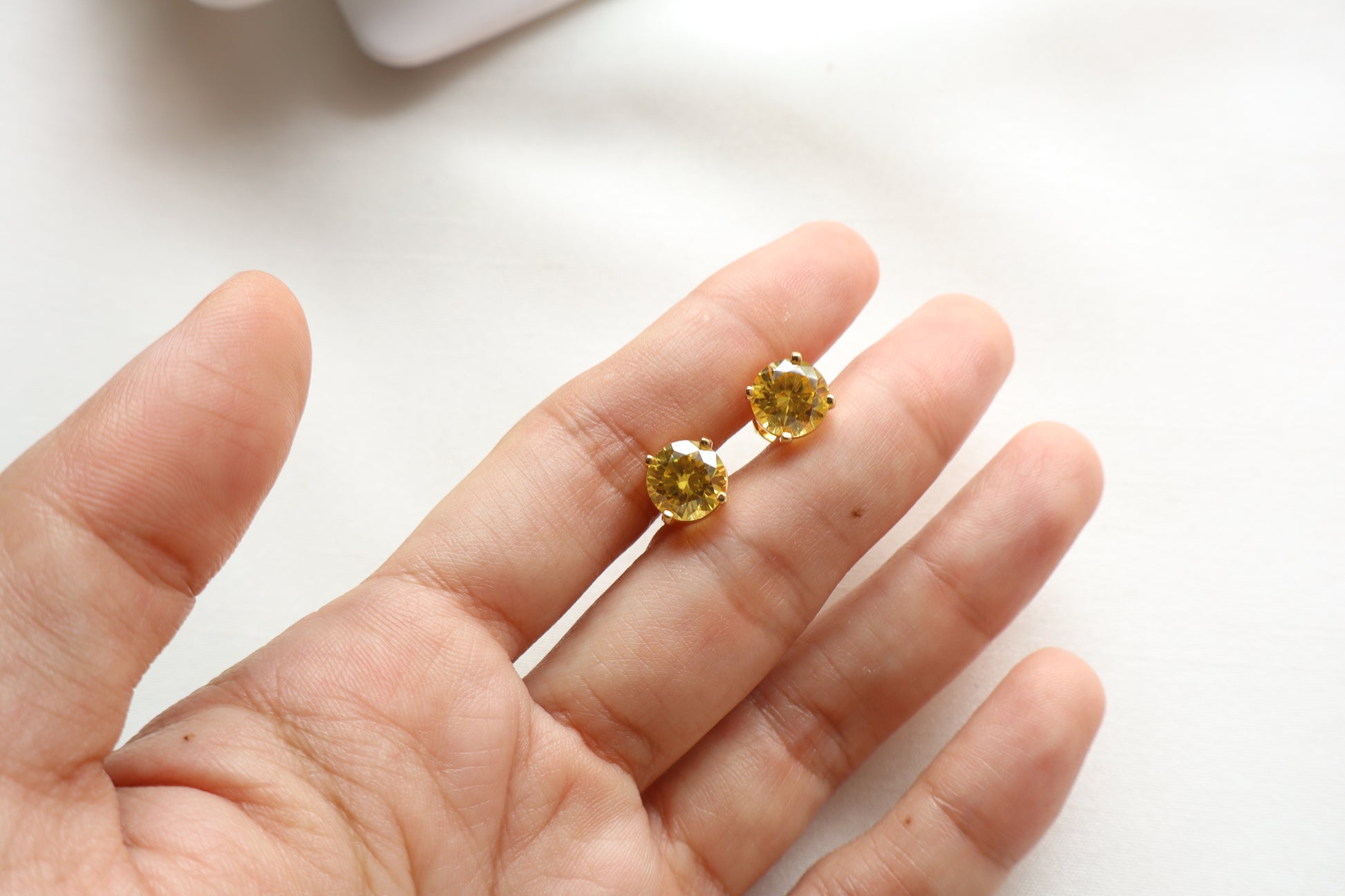 14-karat gold stud earrings featuring 8mm round citrine gemstones, elegantly presented in eco-friendly packaging. Designed in Singapore for timeless sophistication.