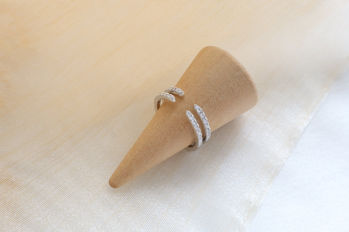 Custom gold bridal ring set with a moissanite engagement ring, diamond wedding band, and engraved groom’s ring, designed as a cohesive family heirloom. Eco-friendly abaca packaging. Singapore corporate jewelry.