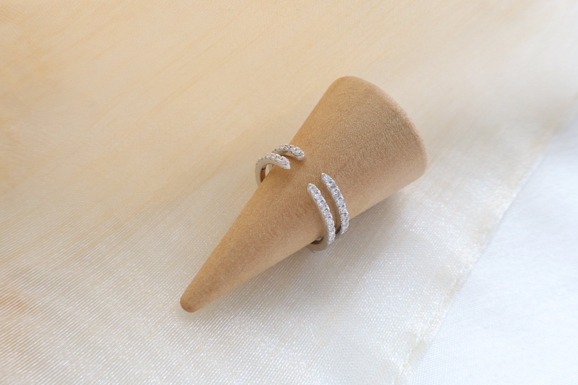 Custom gold bridal ring set with a moissanite engagement ring, diamond wedding band, and engraved groom’s ring, designed as a cohesive family heirloom. Eco-friendly abaca packaging. Singapore corporate jewelry.