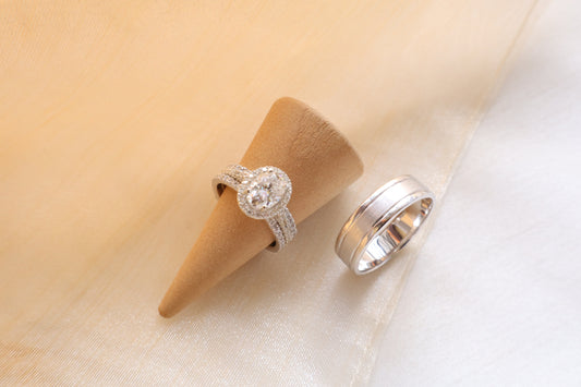 Custom gold bridal ring set with a moissanite engagement ring, diamond wedding band, and engraved groom’s ring, designed as a cohesive family heirloom. Eco-friendly abaca packaging. Singapore corporate jewelry.