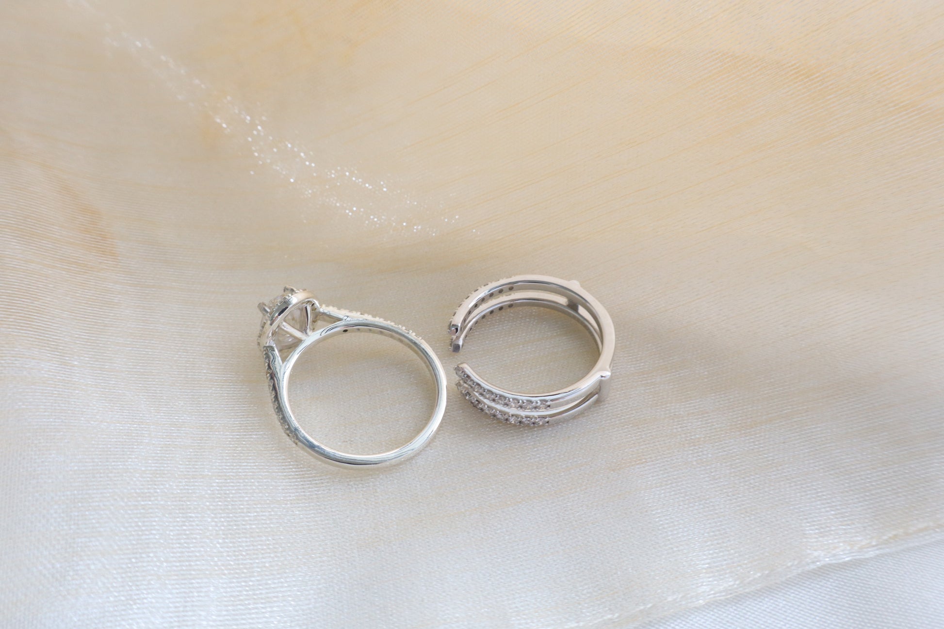 Custom gold bridal ring set with a moissanite engagement ring, diamond wedding band, and engraved groom’s ring, designed as a cohesive family heirloom. Eco-friendly abaca packaging. Singapore corporate jewelry.