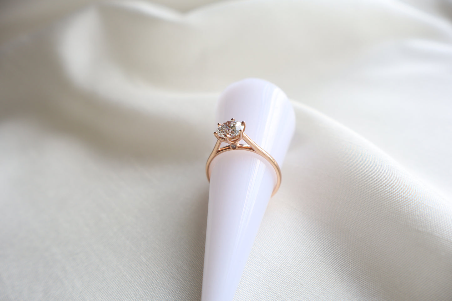 14K rose gold lab diamond engagement ring with concealed accent stone and clean minimalist design, Singapore custom fine jewelry with ethical sourcing