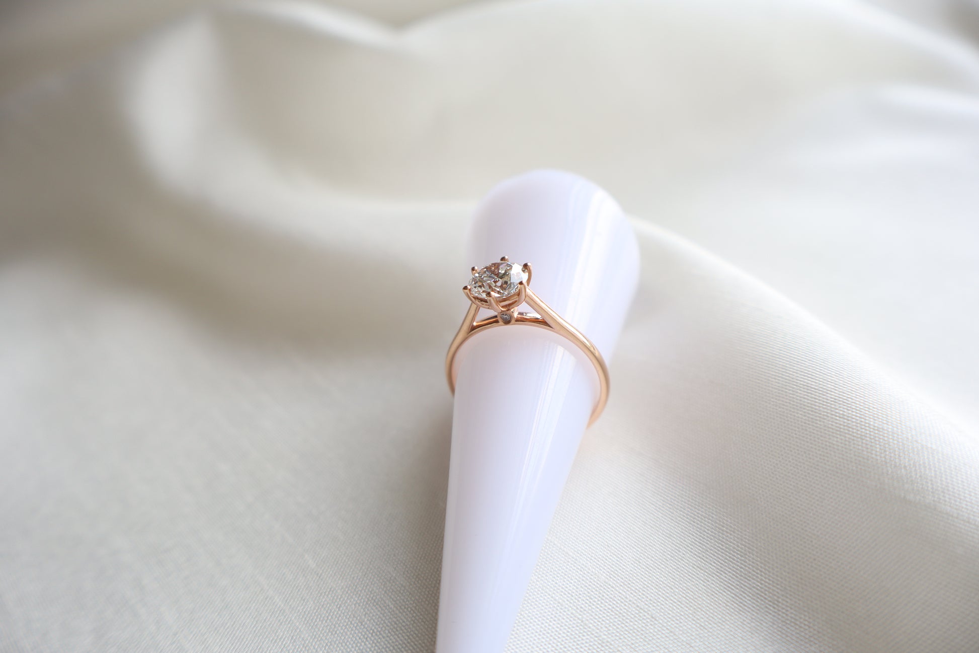 14K rose gold lab diamond engagement ring with concealed accent stone and clean minimalist design, Singapore custom fine jewelry with ethical sourcing