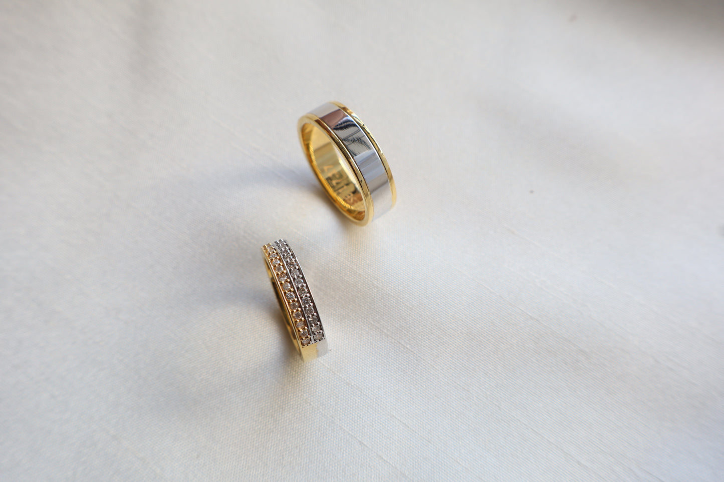Elegant 14K two-tone wedding bands with high-polish and pavé details. Comes in eco-friendly Emildific packaging. Singapore corporate: premium gold craftsmanship.