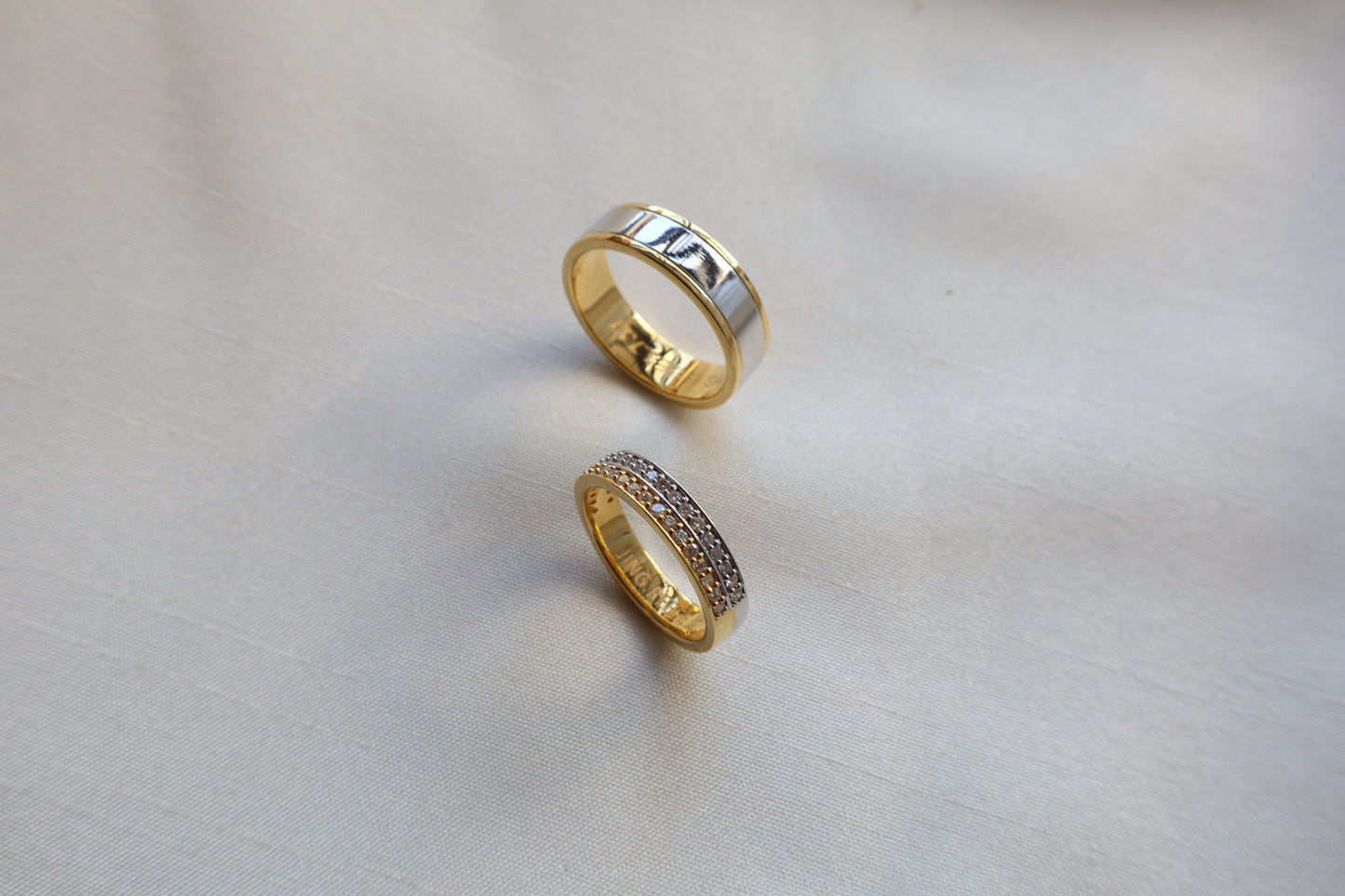Elegant 14K two-tone wedding bands with high-polish and pavé details. Comes in eco-friendly Emildific packaging. Singapore corporate: premium gold craftsmanship.