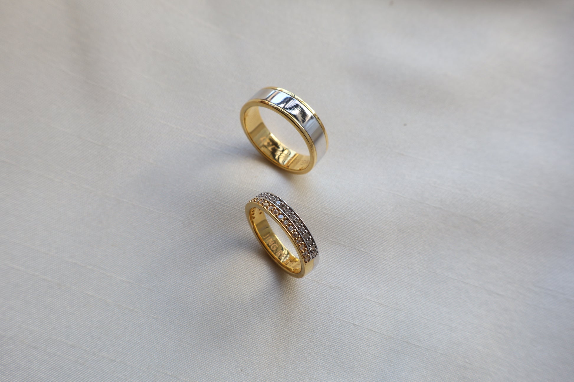 Elegant 14K two-tone wedding bands with high-polish and pavé details. Comes in eco-friendly Emildific packaging. Singapore corporate: premium gold craftsmanship.