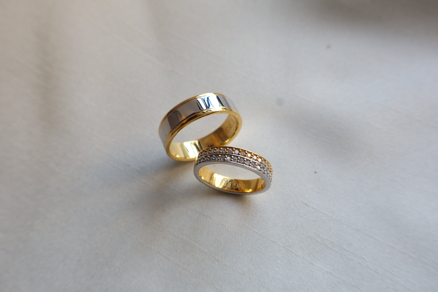 Elegant 14K two-tone wedding bands with high-polish and pavé details. Comes in eco-friendly Emildific packaging. Singapore corporate: premium gold craftsmanship.