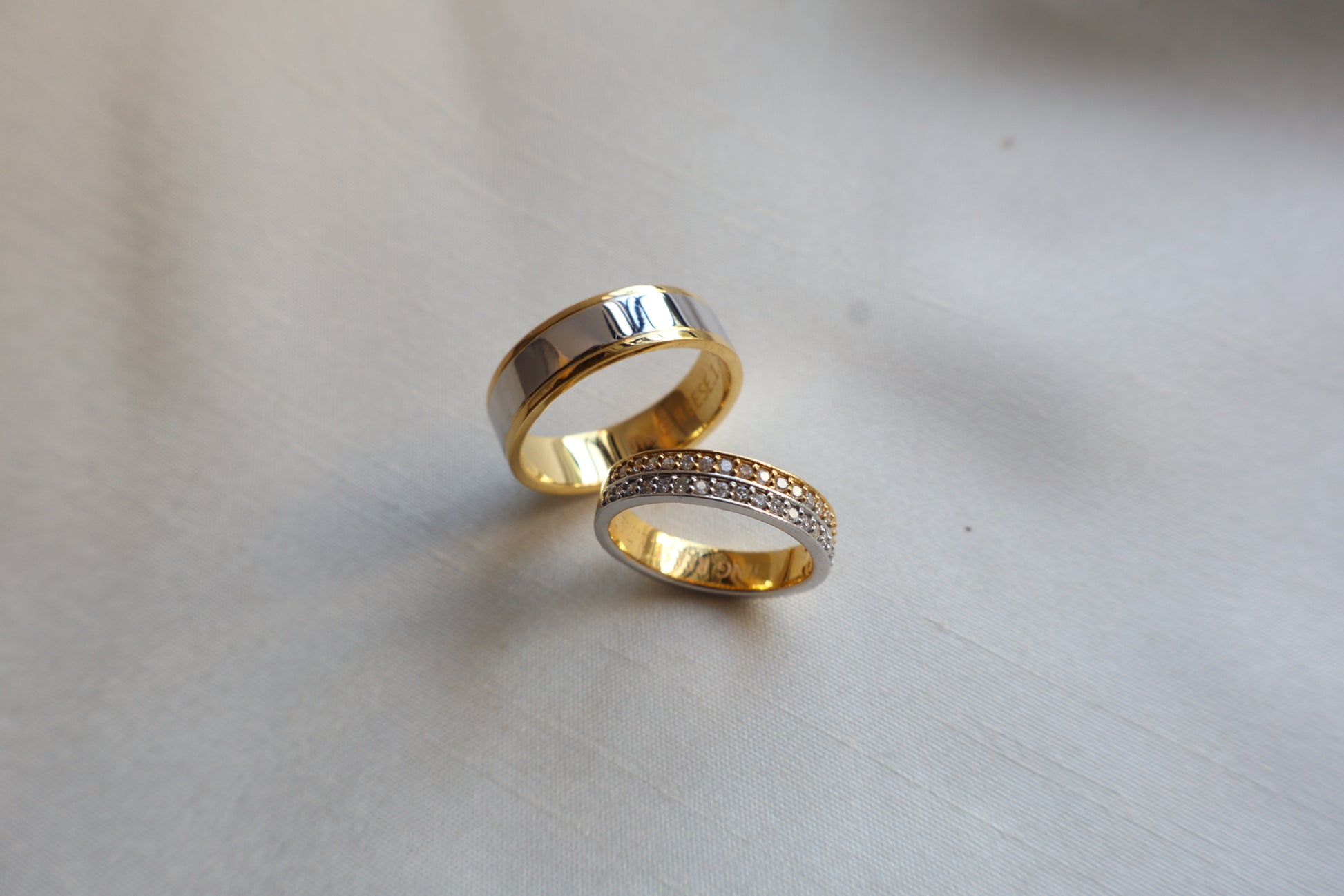 Elegant 14K two-tone wedding bands with high-polish and pavé details. Comes in eco-friendly Emildific packaging. Singapore corporate: premium gold craftsmanship.