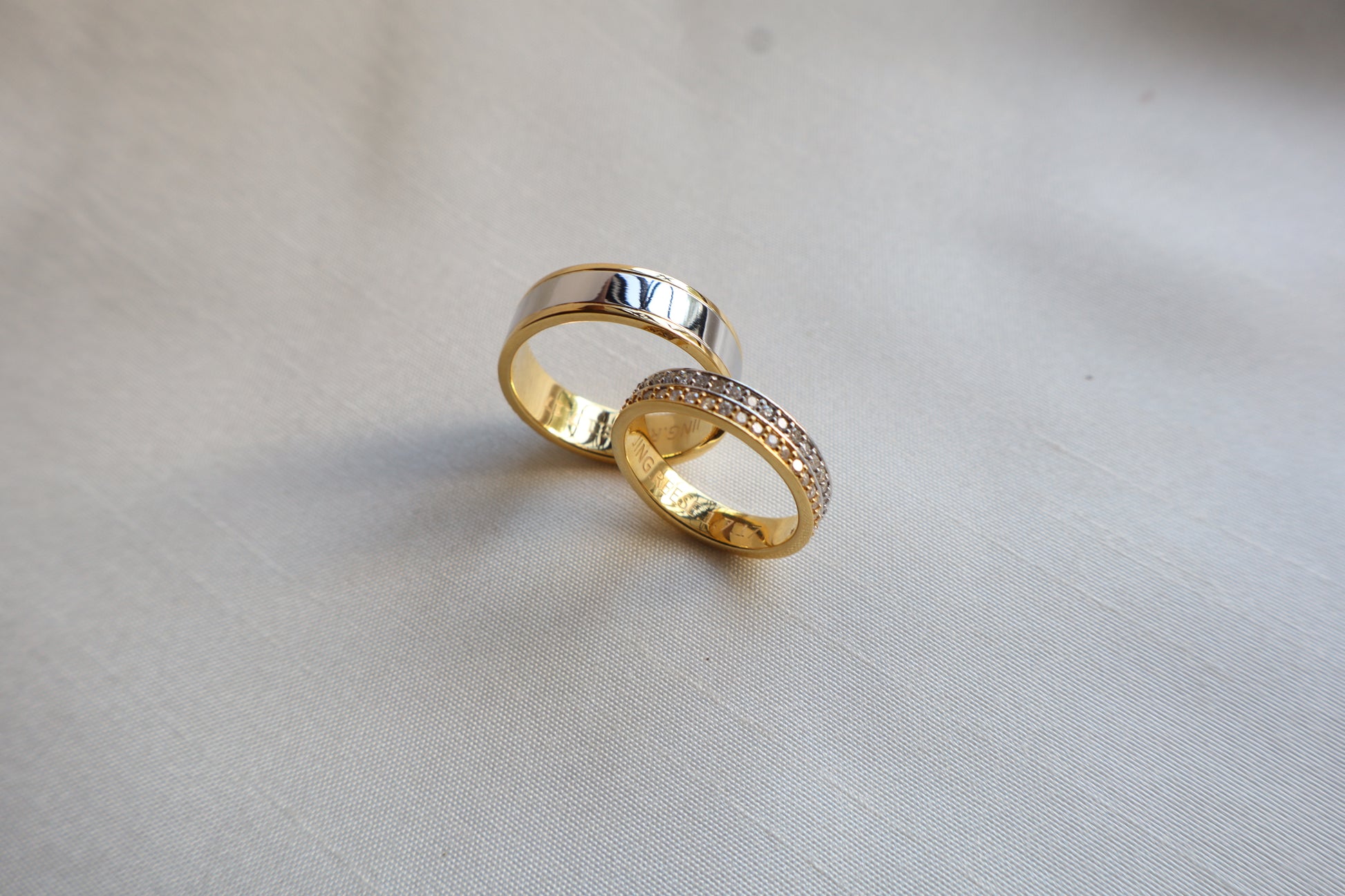 Elegant 14K two-tone wedding bands with high-polish and pavé details. Comes in eco-friendly Emildific packaging. Singapore corporate: premium gold craftsmanship.