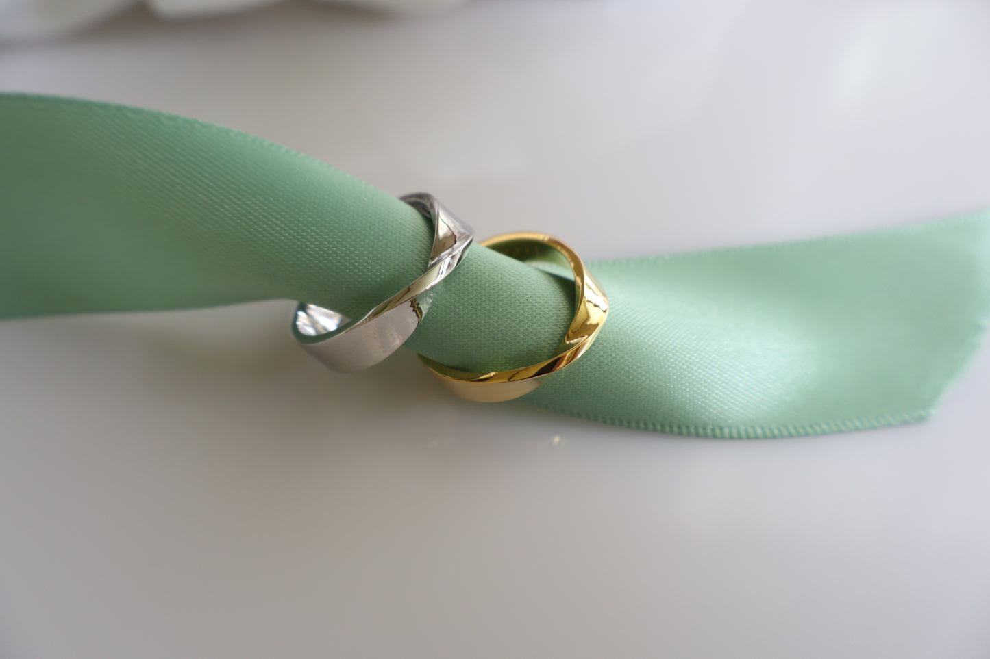 Two-tone silver and gold curved couple rings, minimalist his and hers commitment bands — Corporate service anniversary jewelry — gold pin with logo engraving, Singapore supplier.