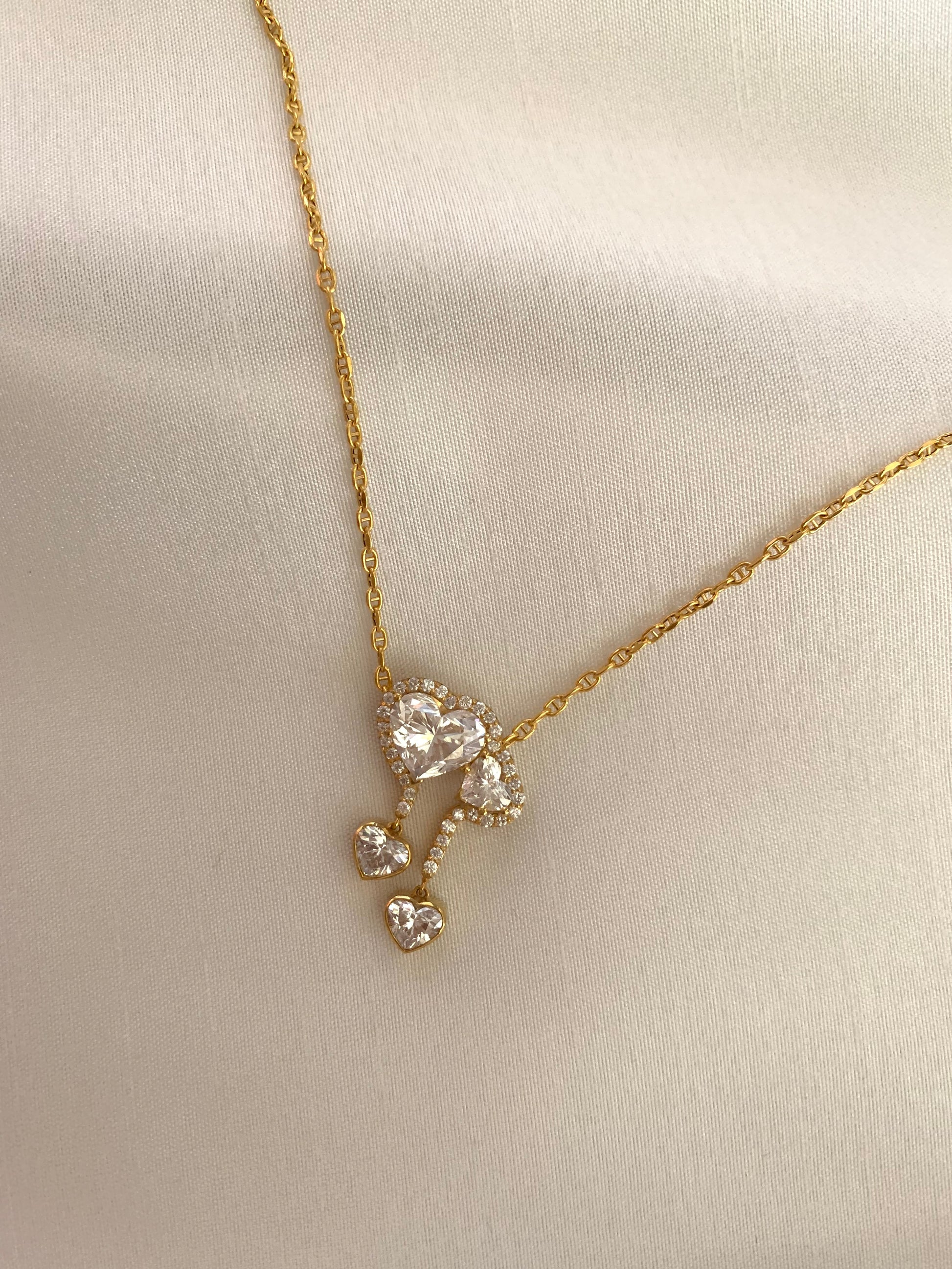 18K gold necklace featuring a 3ct diamond and GIA-certified heart diamonds. Sustainable corporate gift jewelry with abaca packaging. Custom gold-plated necklace, bespoke design in Singapore.