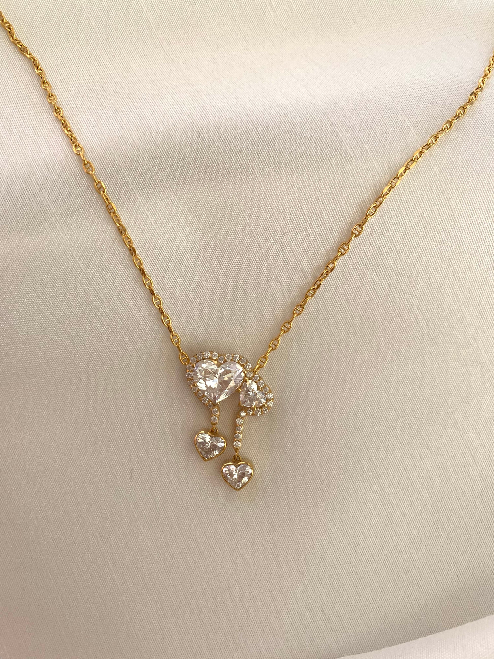 18K gold necklace featuring a 3ct diamond and GIA-certified heart diamonds. Sustainable corporate gift jewelry with abaca packaging. Custom gold-plated necklace, bespoke design in Singapore.