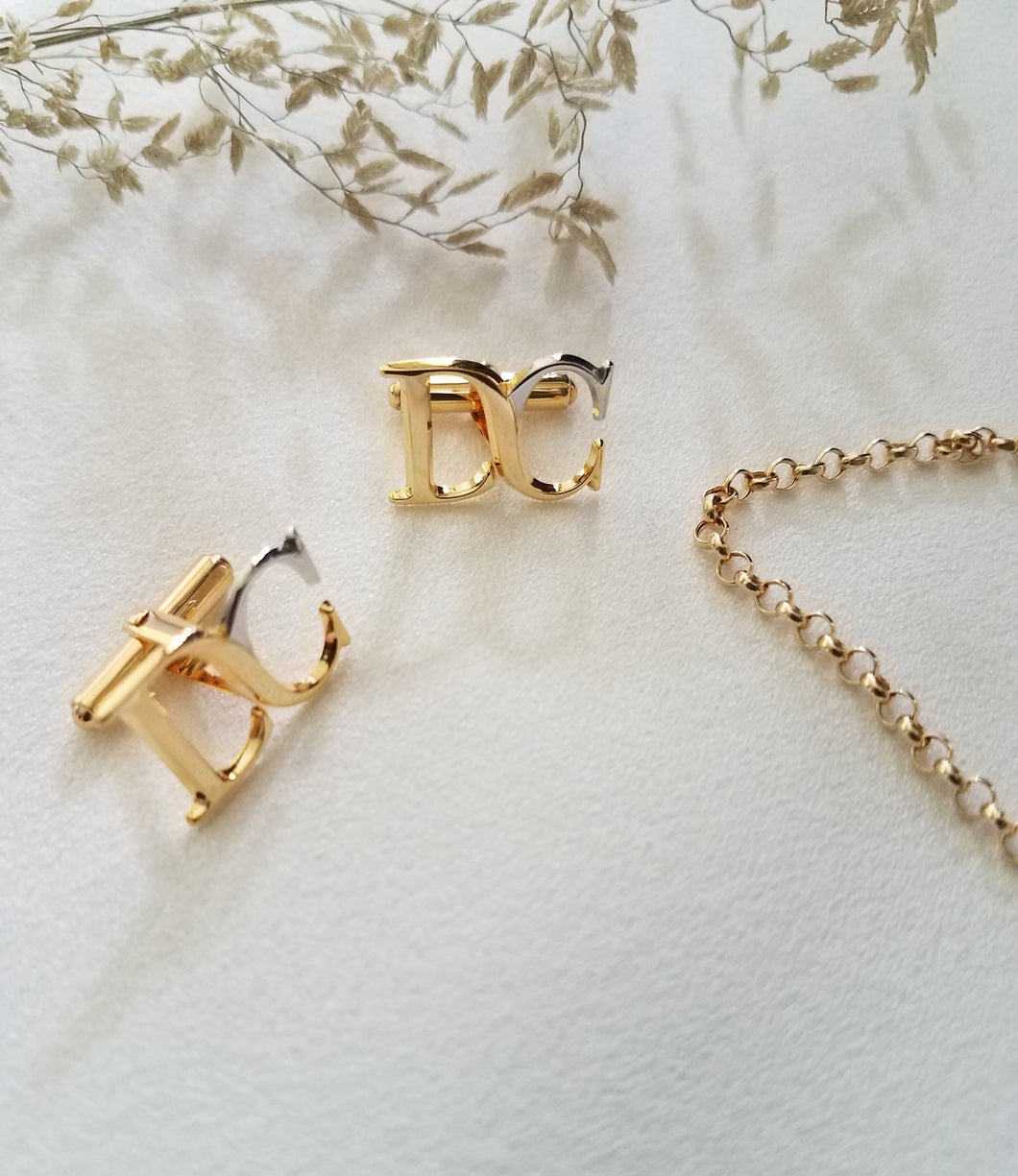 D and C initial cufflinks, set in two-tone (white gold & yellow gold). 