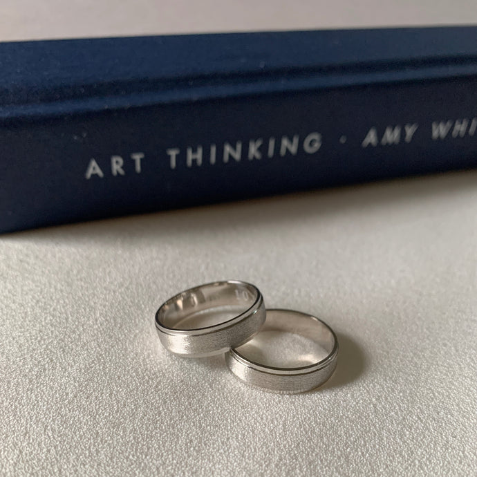 Classic platinum wedding rings in 5mm width.