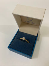 Load image into Gallery viewer, A .50 carat round moissanite on a 14 karat gold on a twisted design band.
