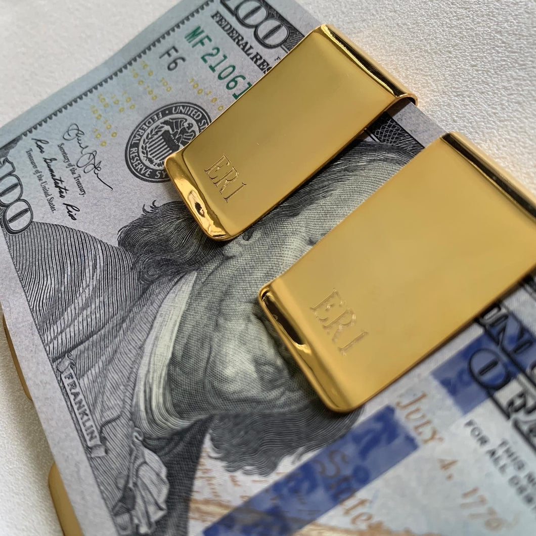 Gold money clip with a name engraving. 