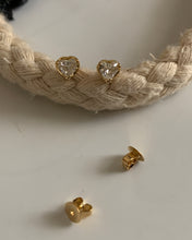Load image into Gallery viewer, Heart shaped diamond stud earrings set in yellow gold.
